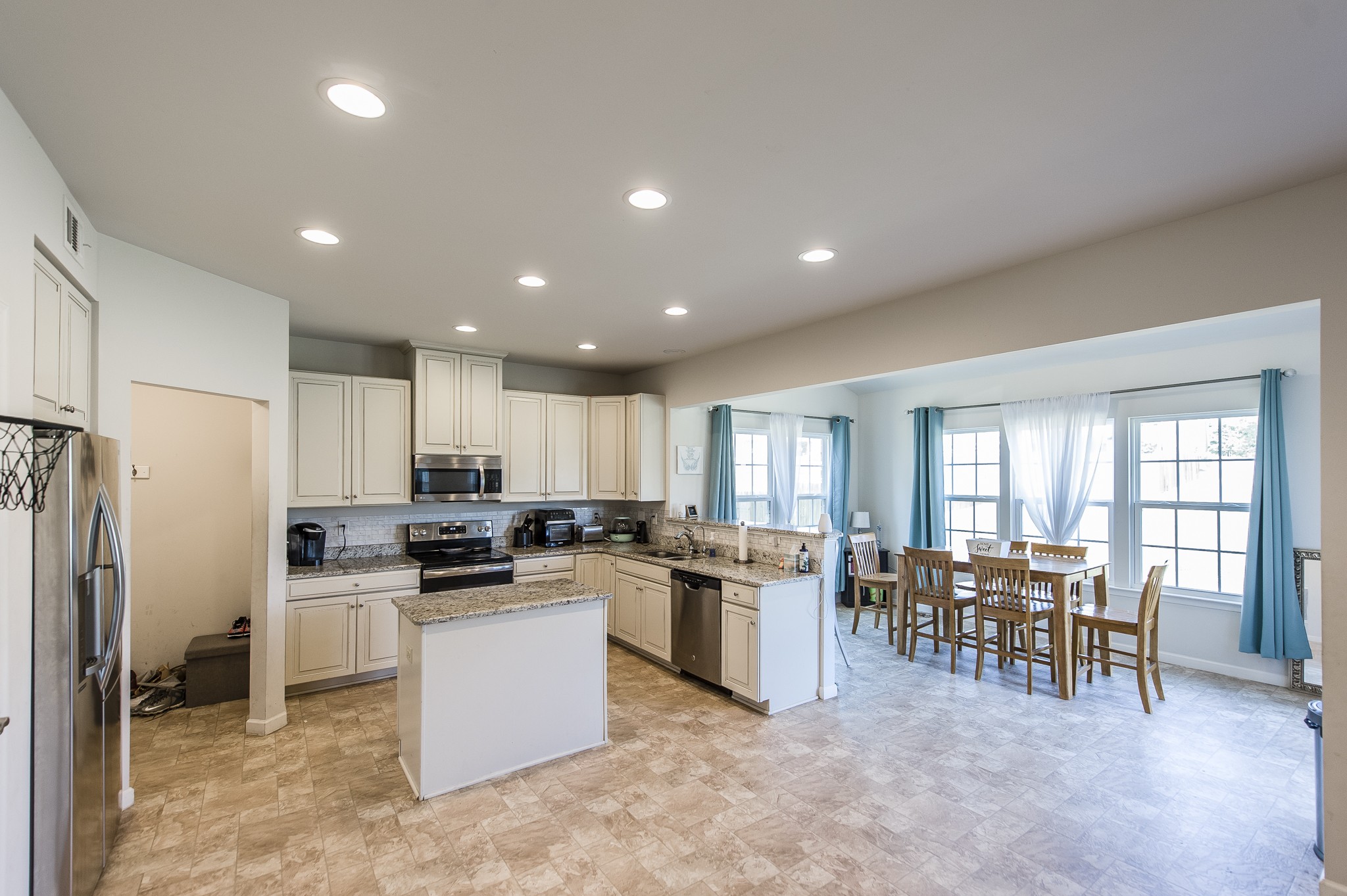 140 Hackney Lane Gallatin, TN 37066 - Photo 20 of 57 a kitchen with refrigerator and chairs