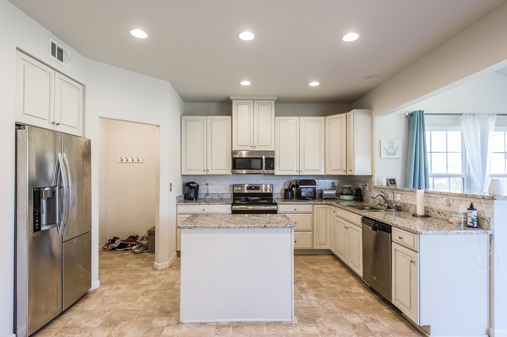 140 Hackney Lane Gallatin, TN 37066 - Photo 27 of 57 a large kitchen with stainless steel appliances granite countertop a stove a sink dishwasher and a refrigerator