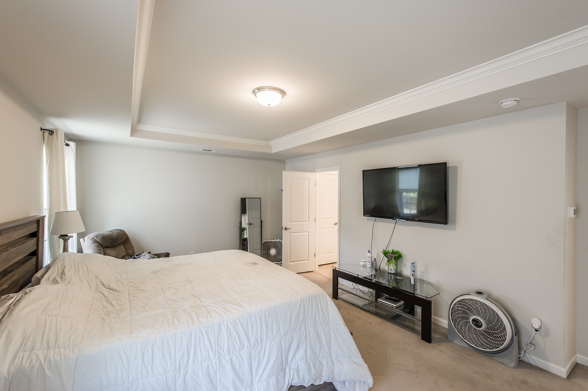 140 Hackney Lane Gallatin, TN 37066 - Photo 34 of 57 a bedroom with a bed a flat screen tv and a couch