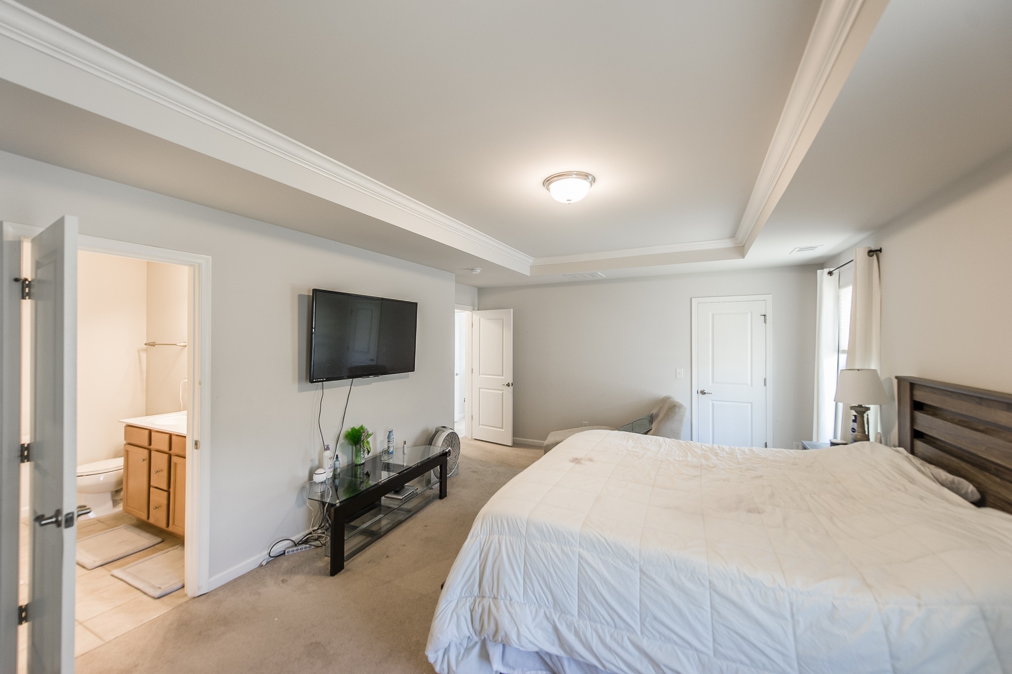 140 Hackney Lane Gallatin, TN 37066 - Photo 35 of 57 a bedroom with a bed and a flat screen tv