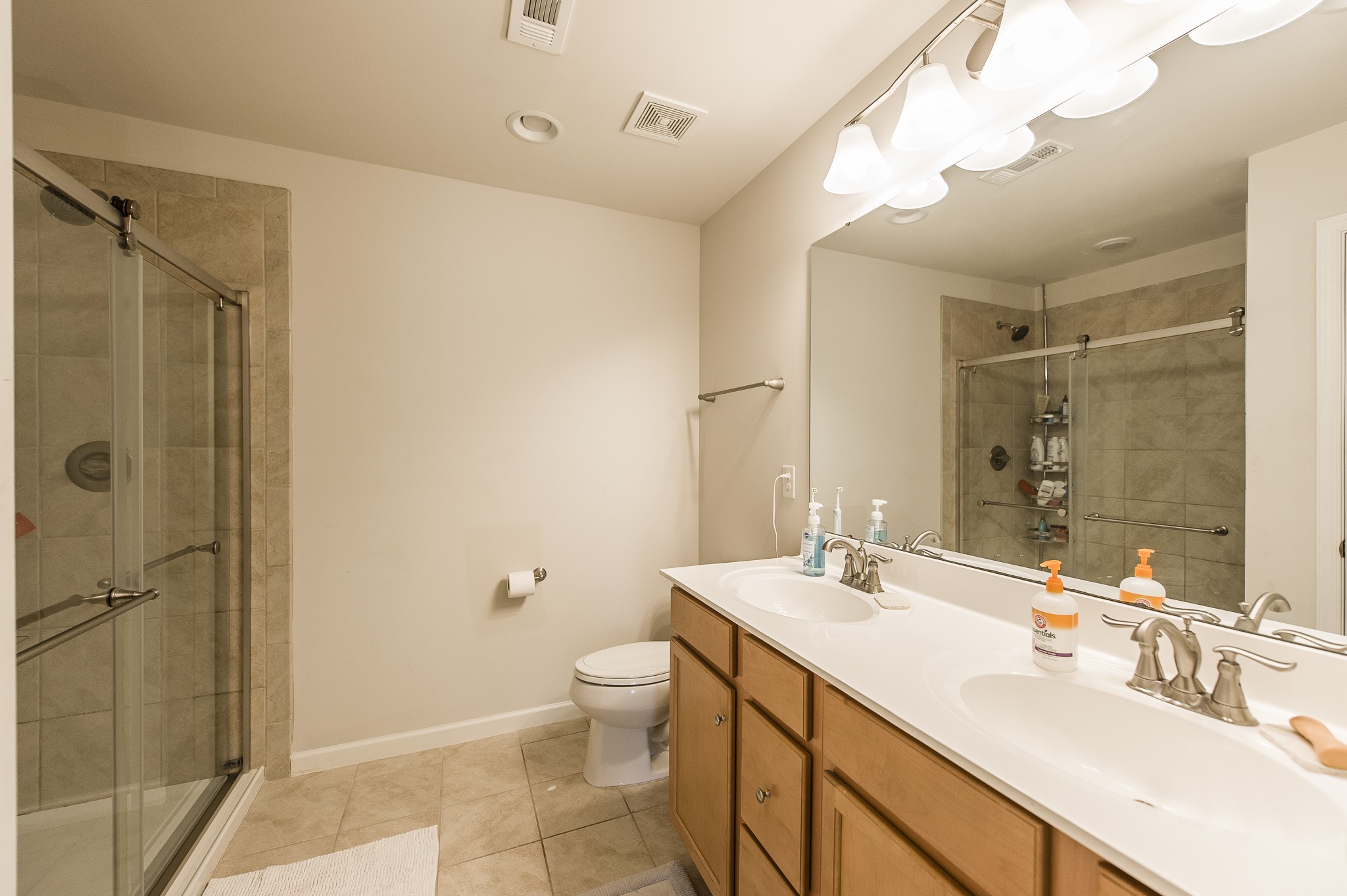 140 Hackney Lane Gallatin, TN 37066 - Photo 37 of 57 a bathroom with a double vanity sink toilet and shower