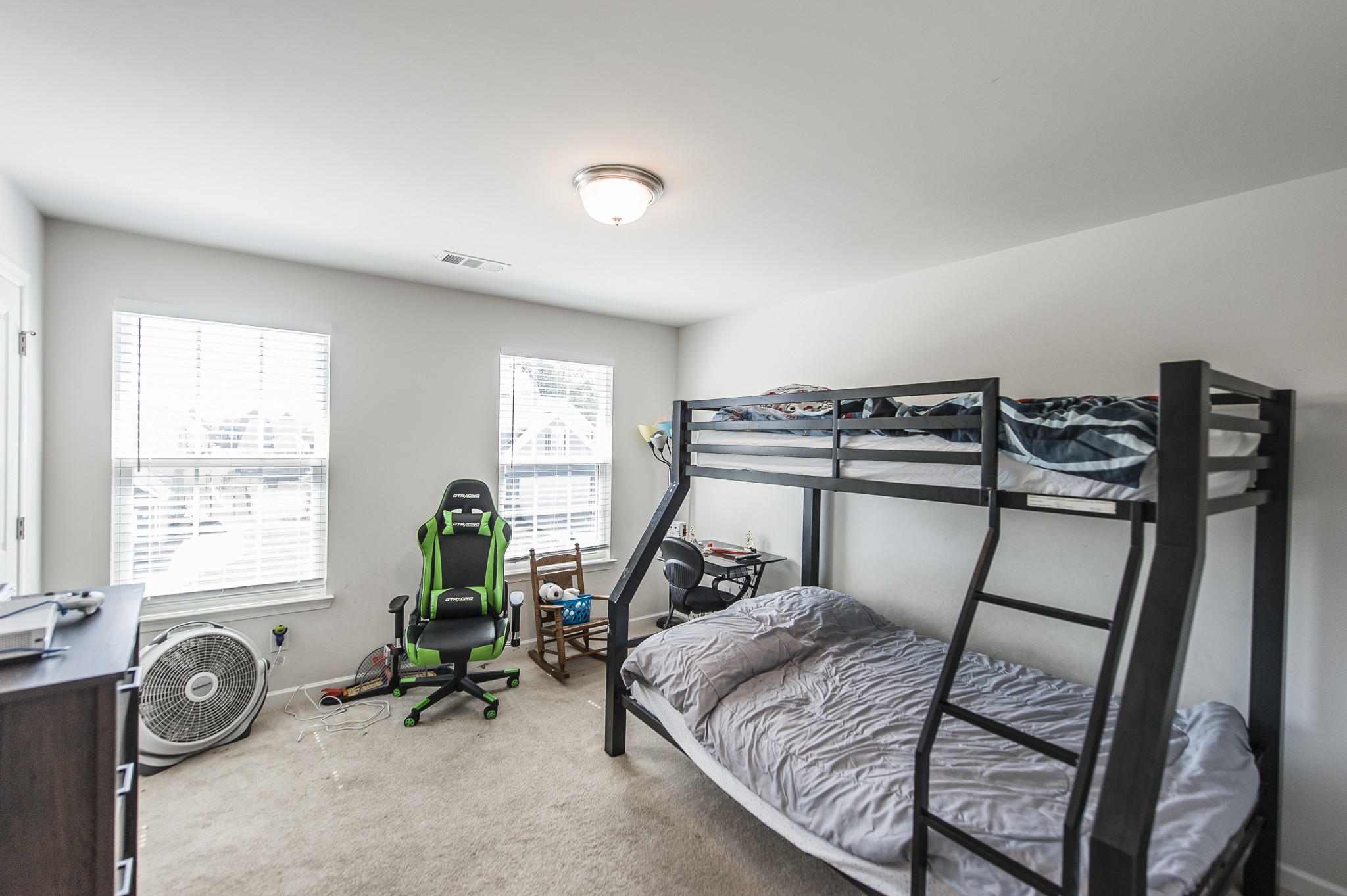 140 Hackney Lane Gallatin, TN 37066 - Photo 42 of 57 a bedroom with a bed a table and chair