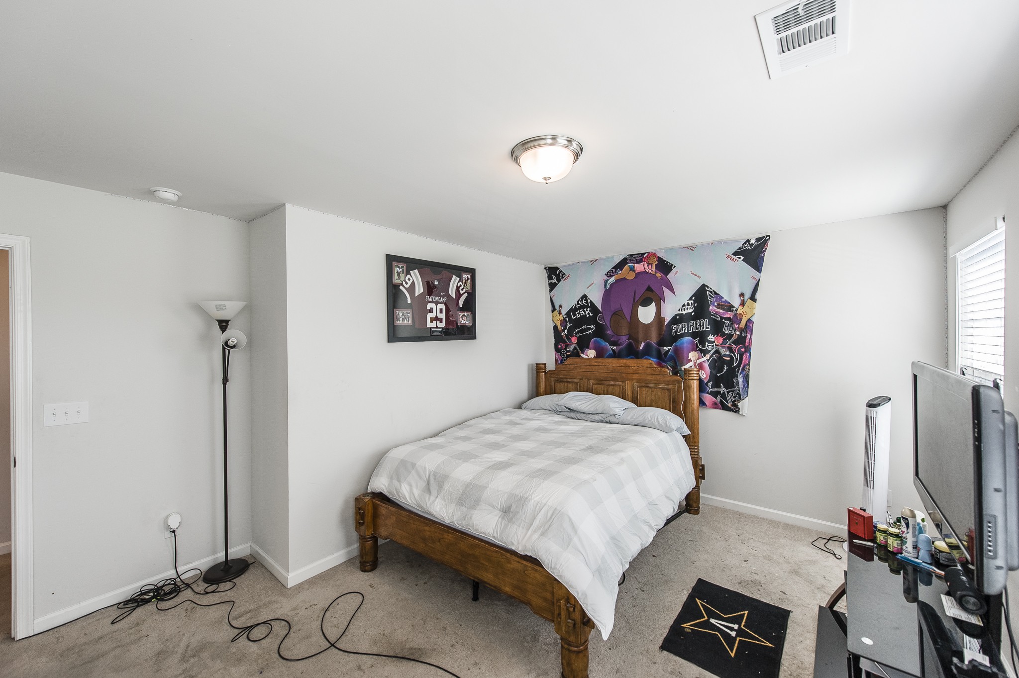 140 Hackney Lane Gallatin, TN 37066 - Photo 45 of 57 a bedroom with a bed and a flat screen tv