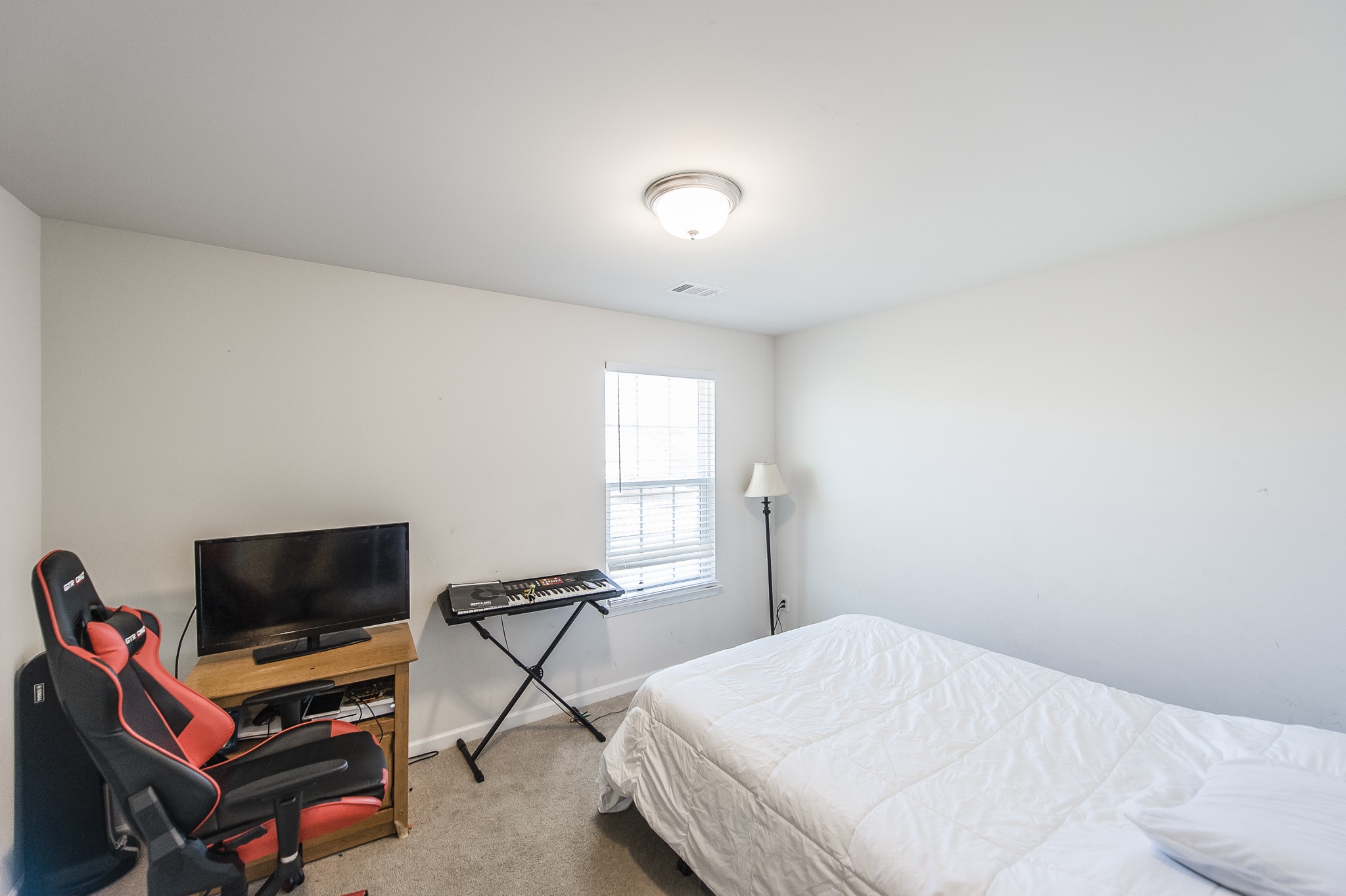 140 Hackney Lane Gallatin, TN 37066 - Photo 48 of 57 a bedroom with a bed and a flat screen tv