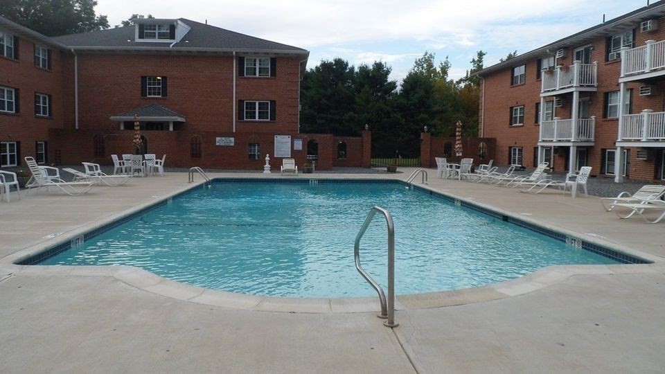 74 Leonard Road, Unit 74 Boxborough, MA 01719 - Photo 2 of 11 a swimming pool view with a outdoor seating