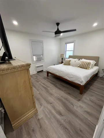 a bedroom with a bed and window