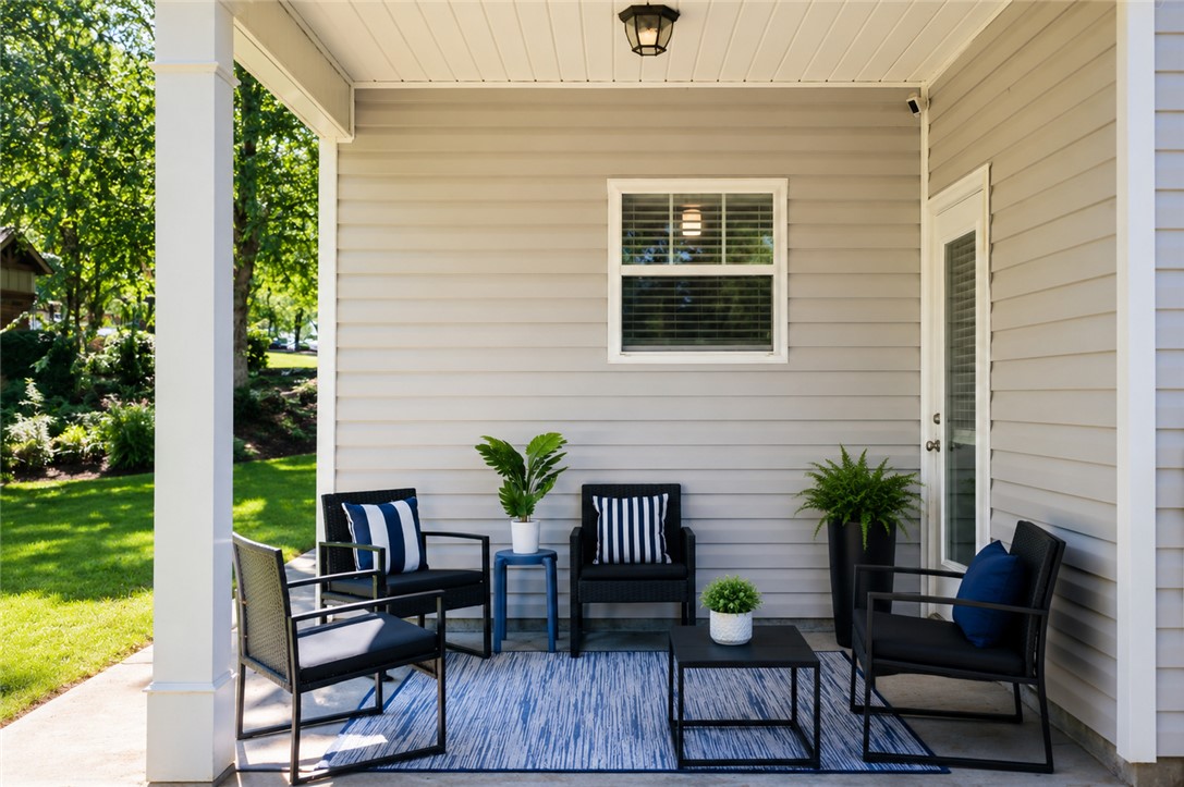 102 Ventura Street Anderson, SC 29621 - Photo 21 of 24 An inviting covered patio provides a delightful outdoor gathering space.
