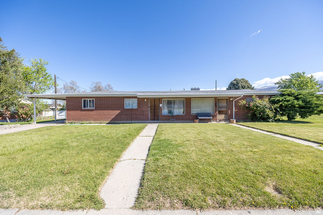 148 West Wicker Lane Bountiful, UT 84010 - Photo 1 of 27 Ranch-style house featuring covered porch, an attached carport, and a front lawn