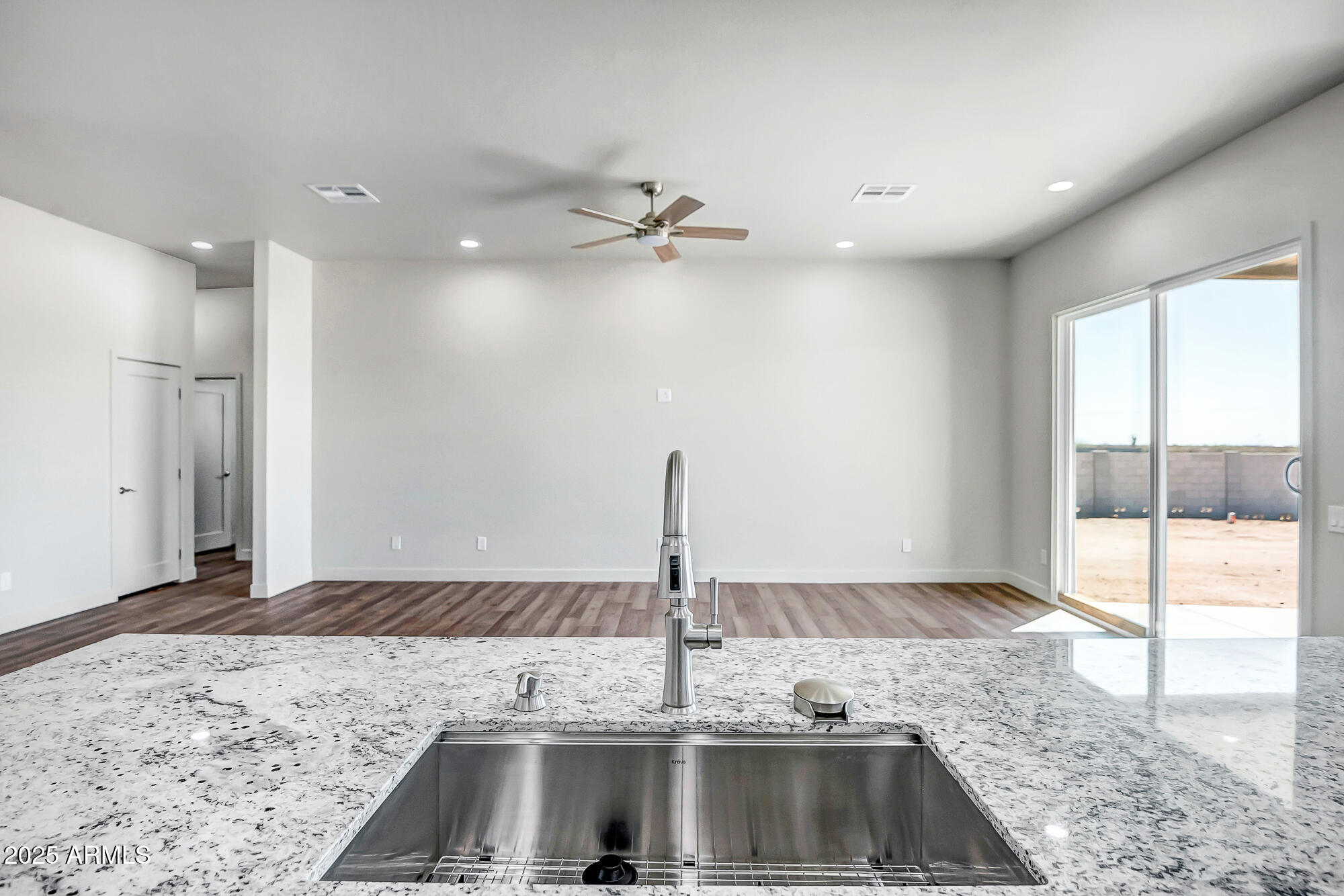 25113 West Lowden Road Wittmann, AZ 85361 - Photo 9 of 37 Kitchen island looking onto great room