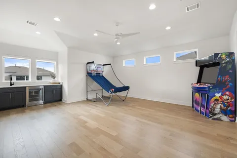 a view of a room with gym equipment and a window