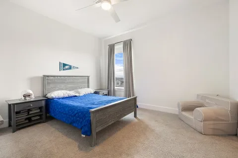 a bedroom with a bed and a couch