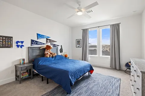 a bed room with a bed and a window