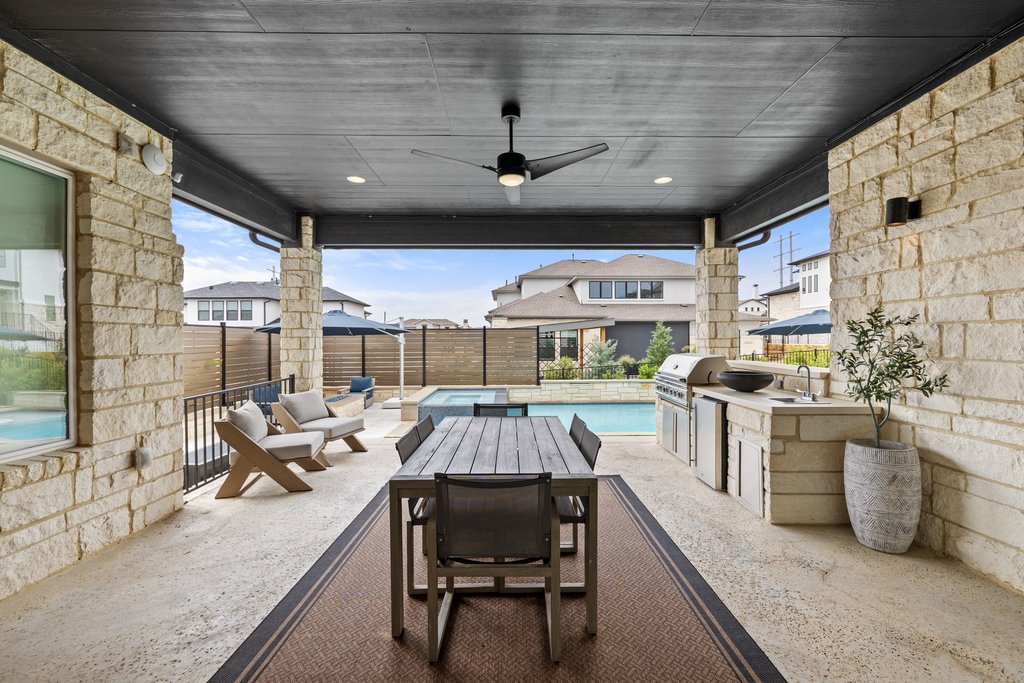 802 Geiger Path Austin, TX 78738 - Photo 29 of 40 Spacious covered patio with an outdoor grill, beverage cooler and dining area.
