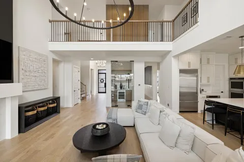 a lobby with furniture and a view of kitchen