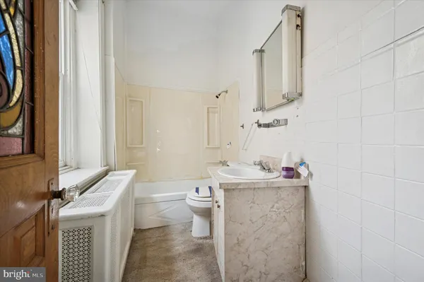 a kitchen with a sink a stove and cabinets
