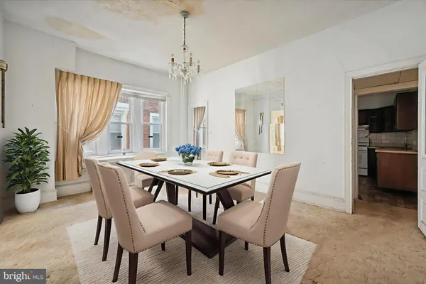a kitchen with stainless steel appliances a sink a stove a microwave cabinets and a refrigerator