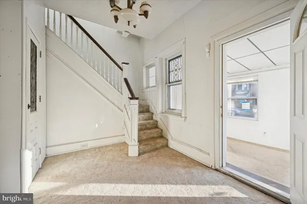 a view of a hallway with a white walls