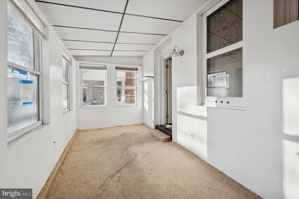 a view of a hallway with a white walls