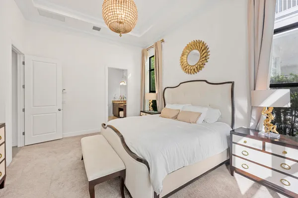 a bedroom with a bed and a night stand