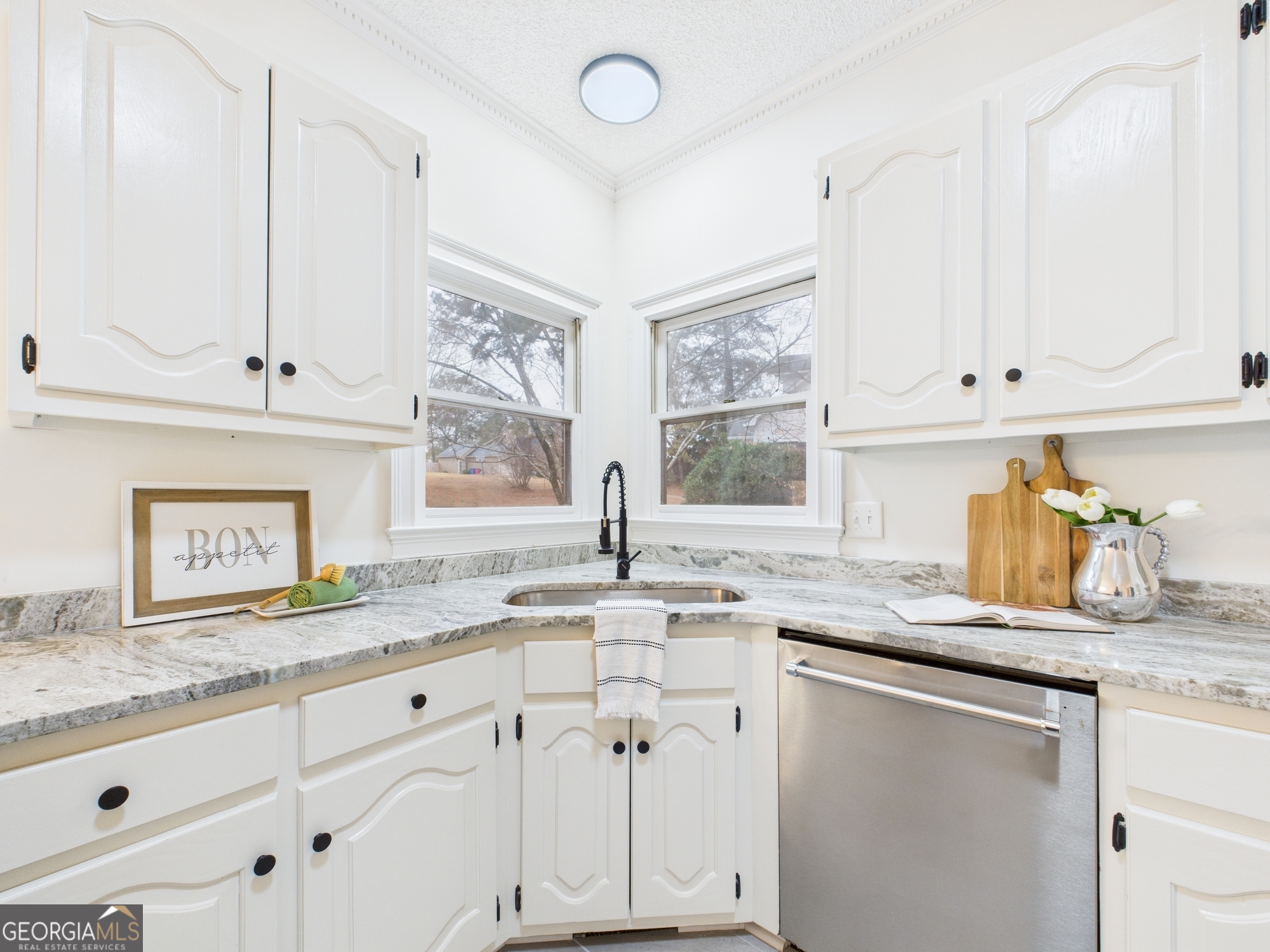607 Chastain Place Macon, GA 31210 - Photo 14 of 63 a kitchen with granite countertop white cabinets and a sink