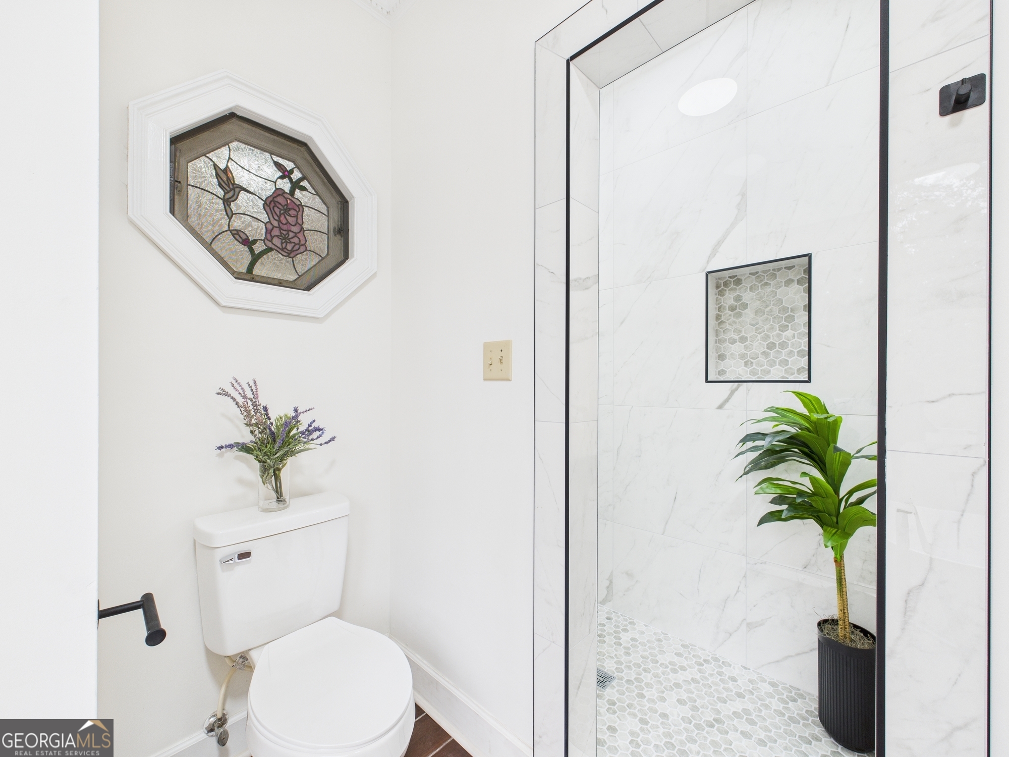 607 Chastain Place Macon, GA 31210 - Photo 44 of 63 a white toilet sitting next to a bathroom