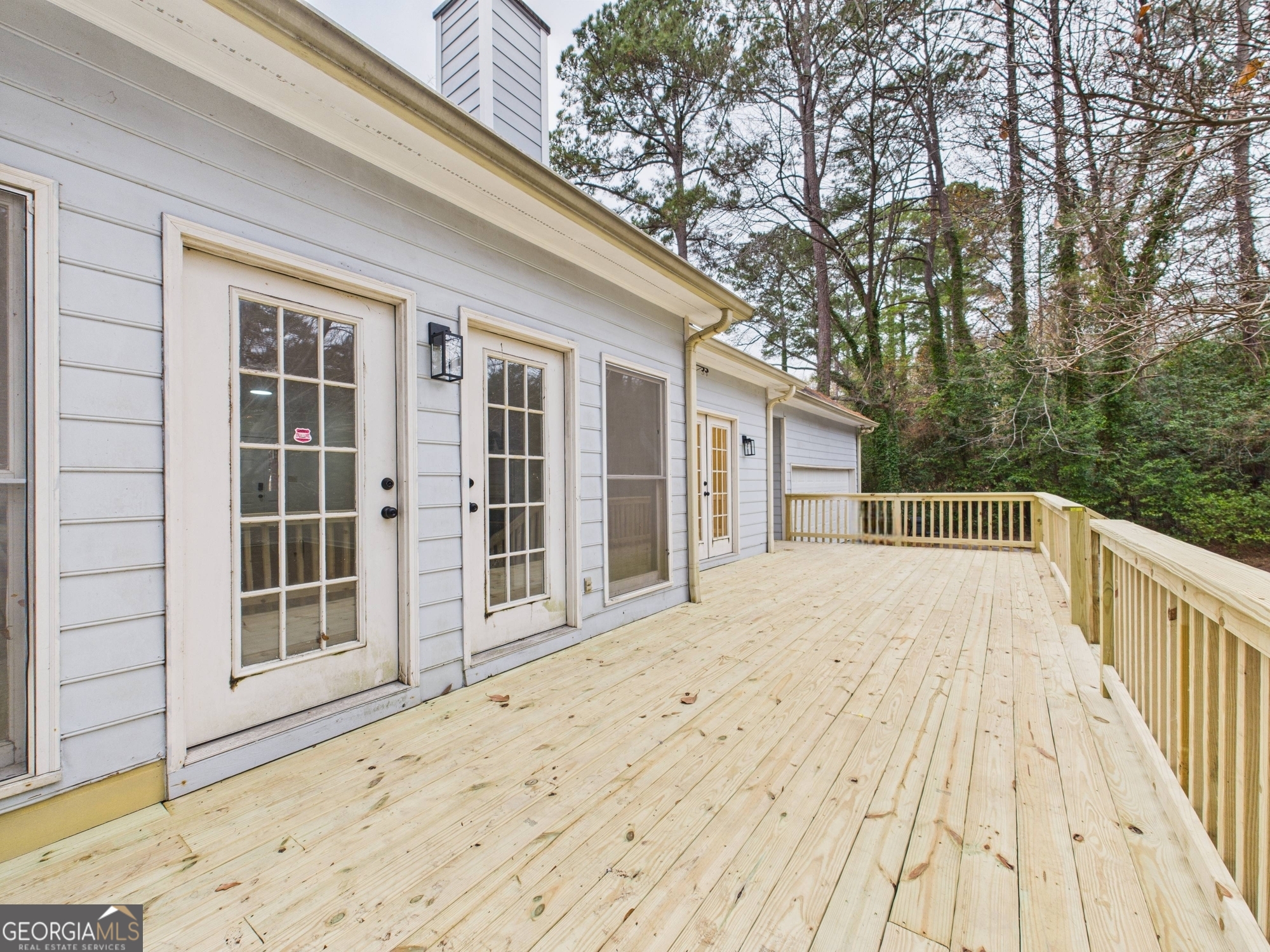 607 Chastain Place Macon, GA 31210 - Photo 53 of 63 a view of backyard with large trees and wooden fence