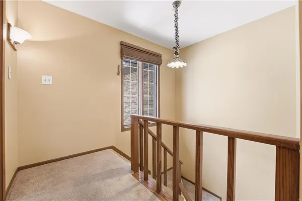 a view of a hallway with windows