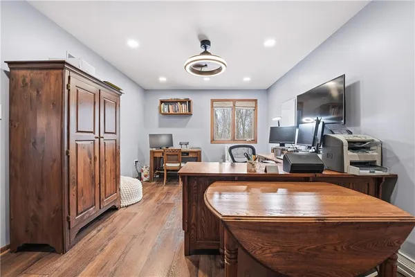 a dining room with furniture and wooden floor
