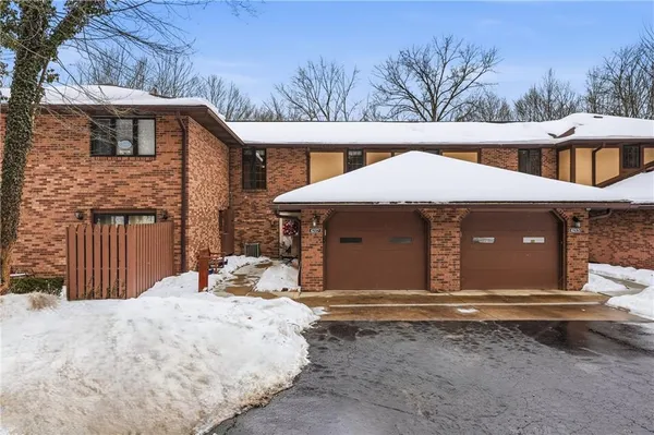 a house with trees in the background