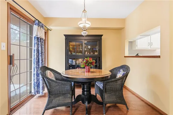 a dining room with furniture and window