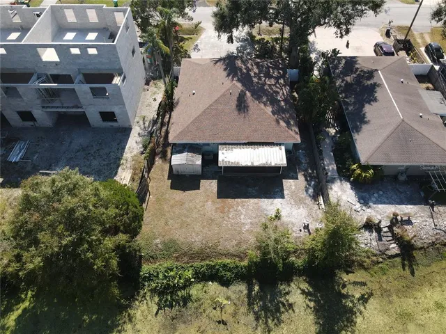 an aerial view of residential house with outdoor space