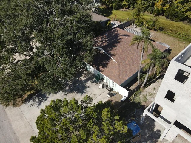 an aerial view of a house with a lake view