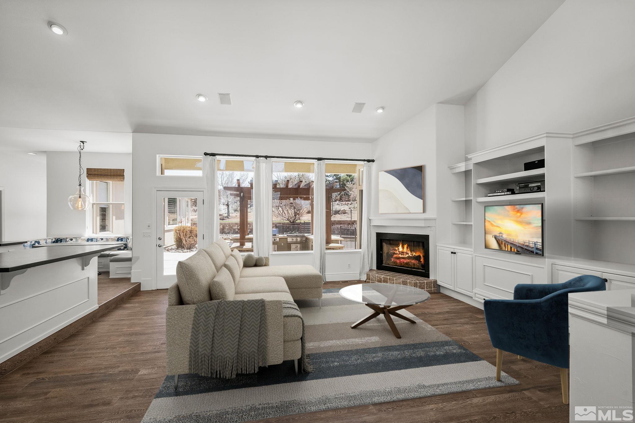 4900 Gallup Road Reno, NV 89511 - Photo 3 of 38 a living room with fireplace furniture and a fireplace