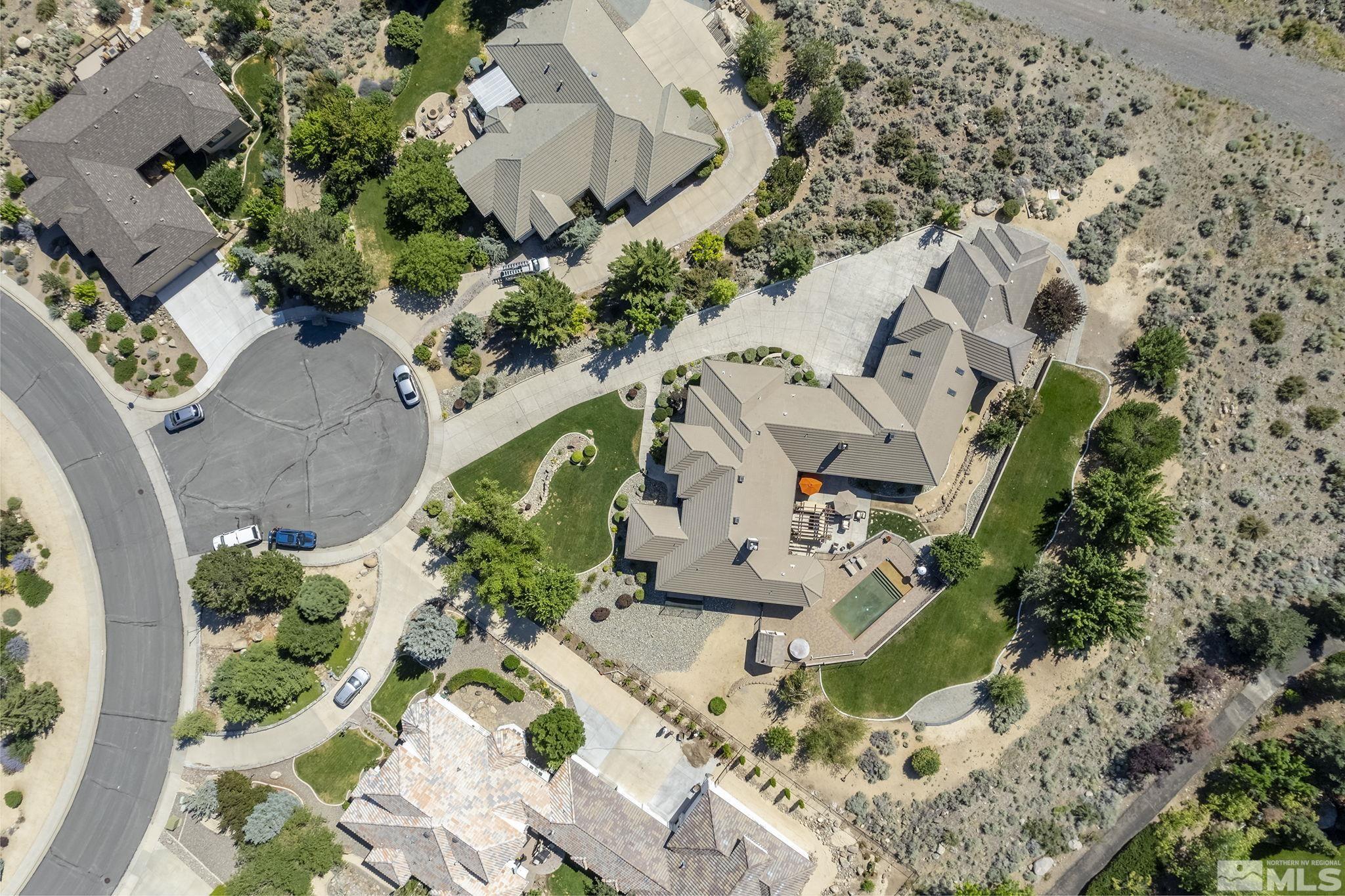 4900 Gallup Road Reno, NV 89511 - Photo 32 of 38 an aerial view of a house with a yard and large trees