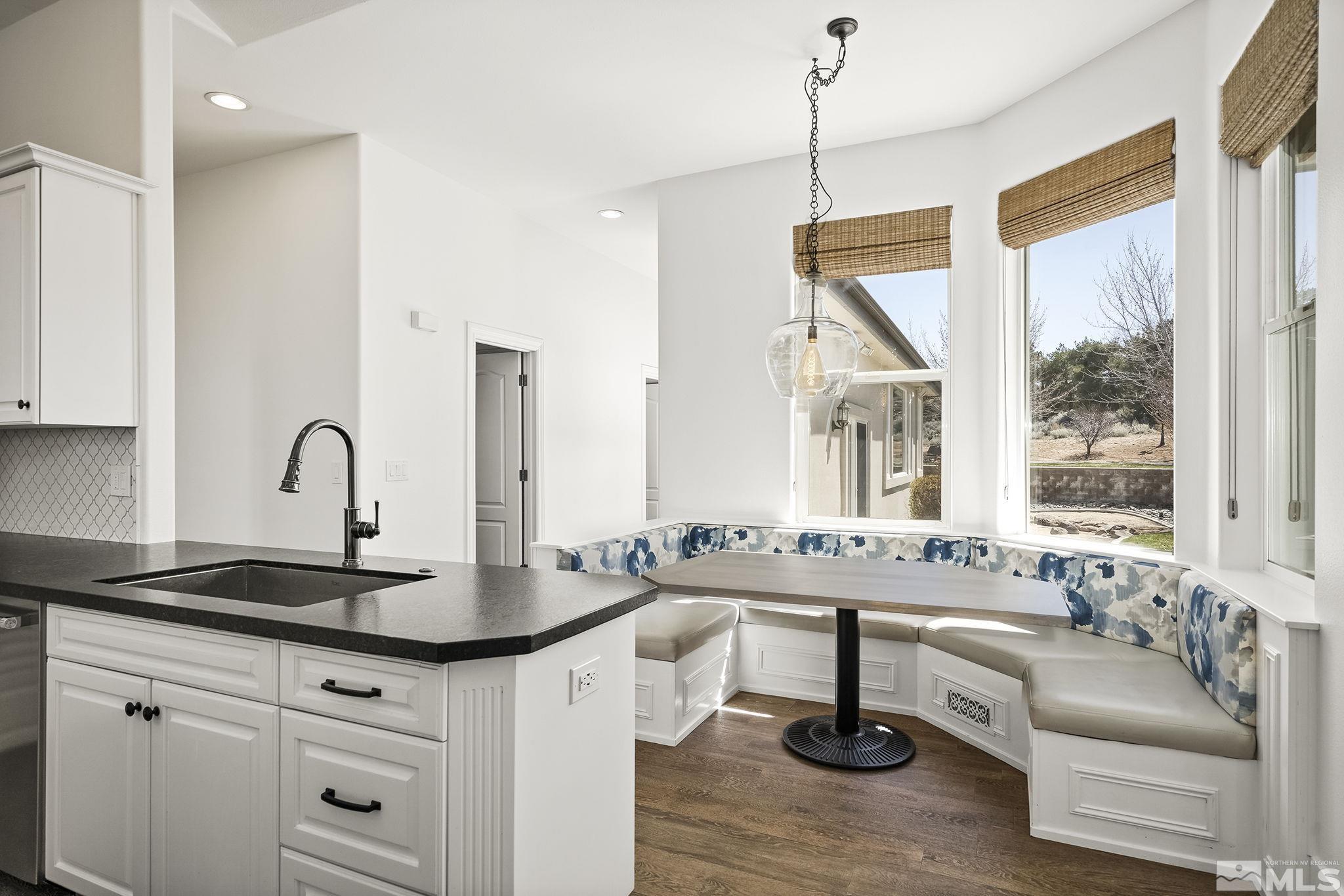 4900 Gallup Road Reno, NV 89511 - Photo 8 of 38 a kitchen with counter top space and windows