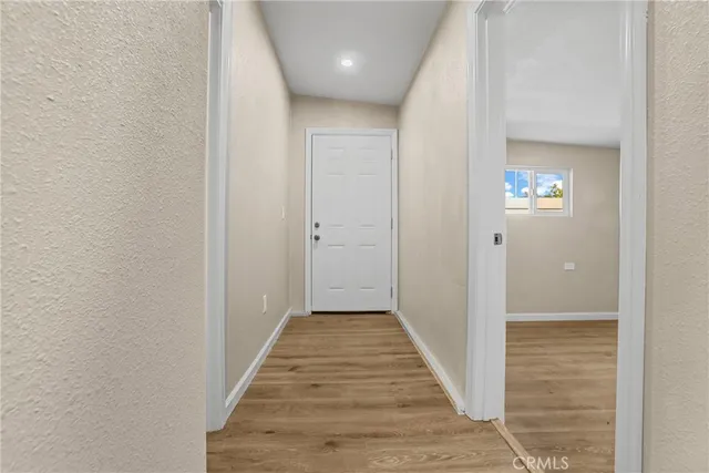 a kitchen with a stove a sink and a refrigerator