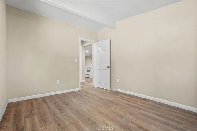 a view of a backyard with wooden fence