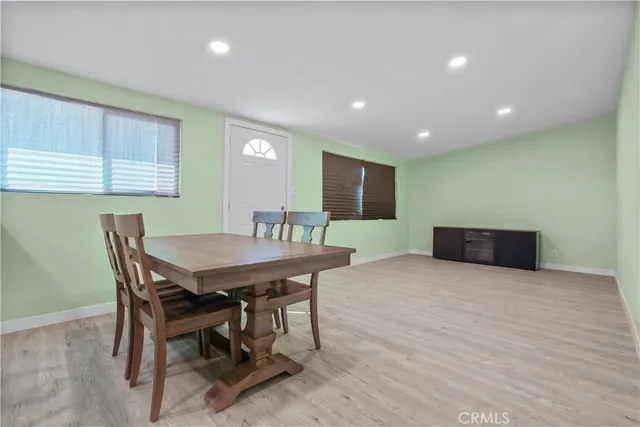 a kitchen with a sink a stove and cabinets