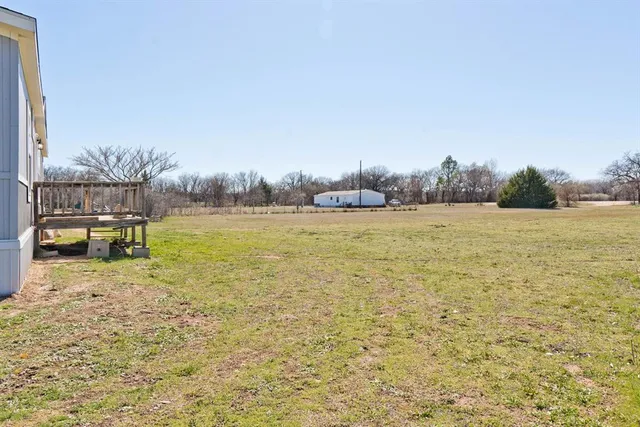 a view of a swimming pool and an outdoor space