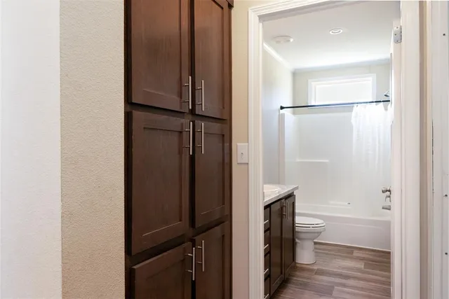 a bathroom with a shower and a toilet