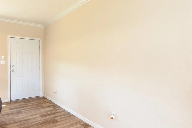 a view of a small space with wooden floor