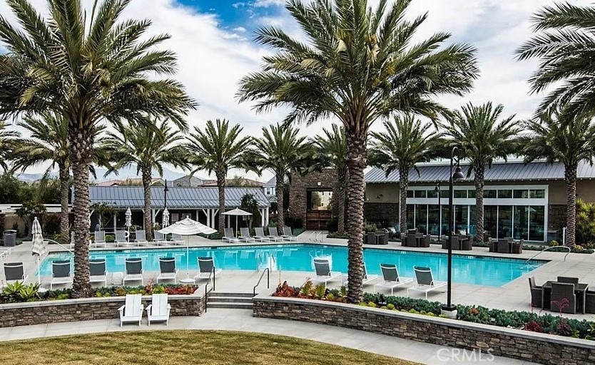 61 Windwalker Way Tustin, CA 92782 - Photo 14 of 16 a swimming pool with outdoor seating and yard