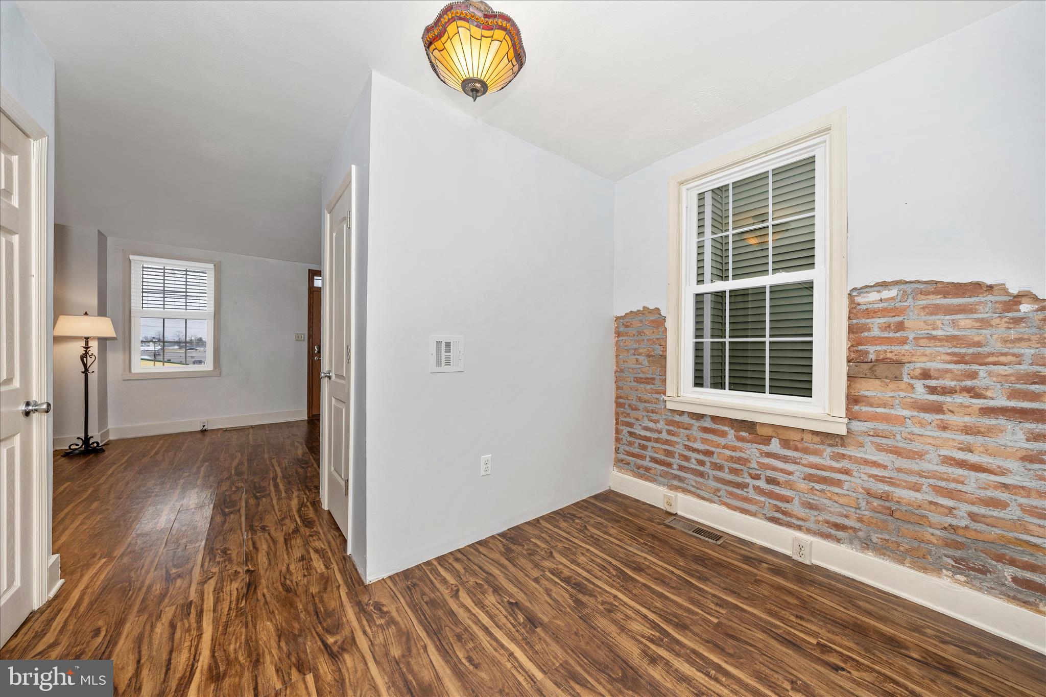 515 East Church Street Frederick, MD 21701 - Photo 8 of 56 Dining room looks classic with lighting and brick
