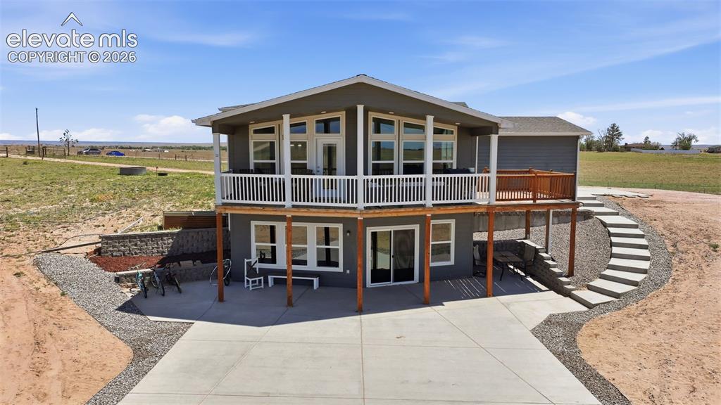 23335 Sanborn Road Calhan, CO 80808 - Photo 26 of 28 Rear patio and outdoor living spaces designed to fully enjoy the peaceful country setting
