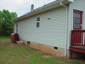 5635 Bell Road Dillwyn, VA 23936 - Photo 2 of 10 a backyard of a house with table and chairs