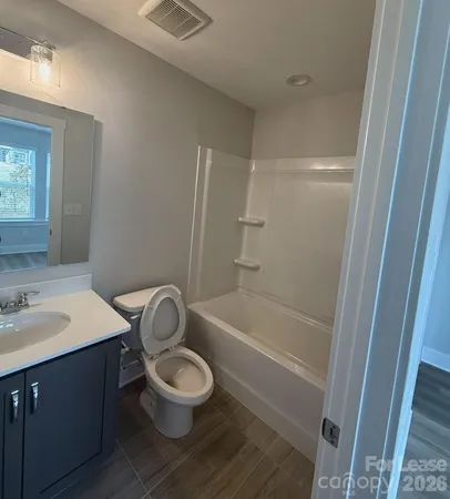 a bathroom with a sink a toilet and a bathtub
