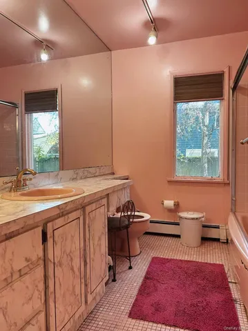 a room with sink and window