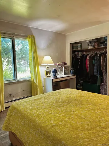 a bed room with a bed and a window