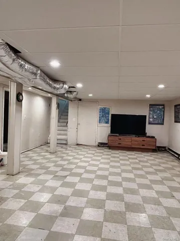 a view of a building stairs and a wooden floor