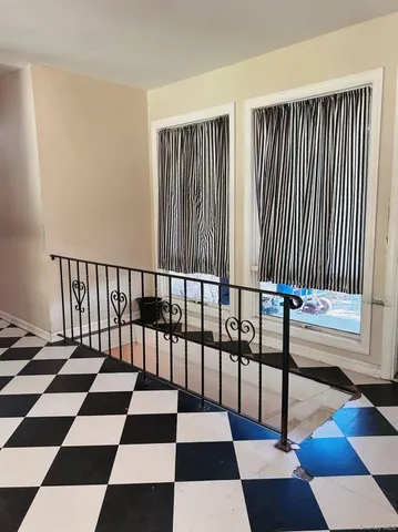 a view of a room with lots of black and white checkered floor